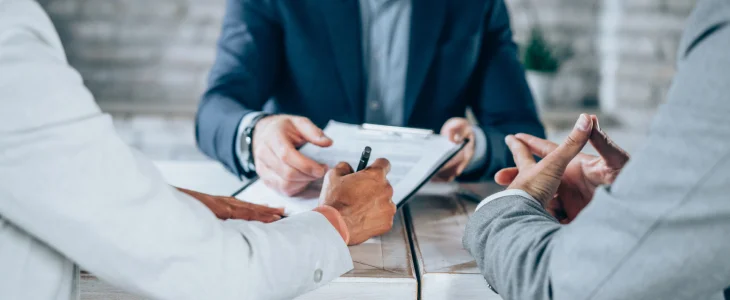 Real estate investors discussing their marketing strategy