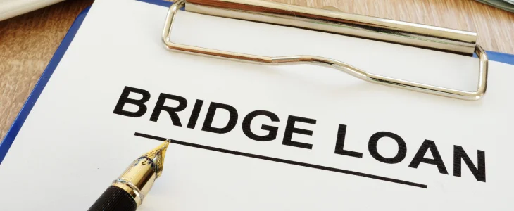 Bridge loan written on a clipboard.